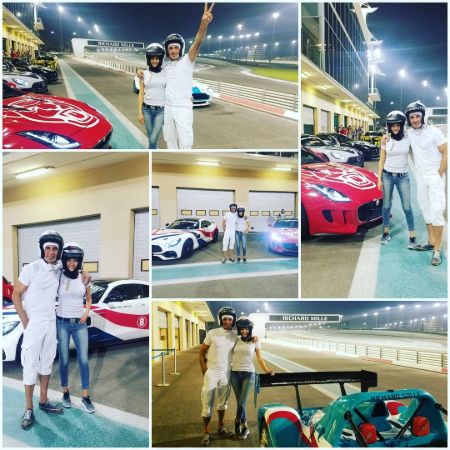 Instagram Picture of Shaun and his wife riding race cars in Abu Dhabi.